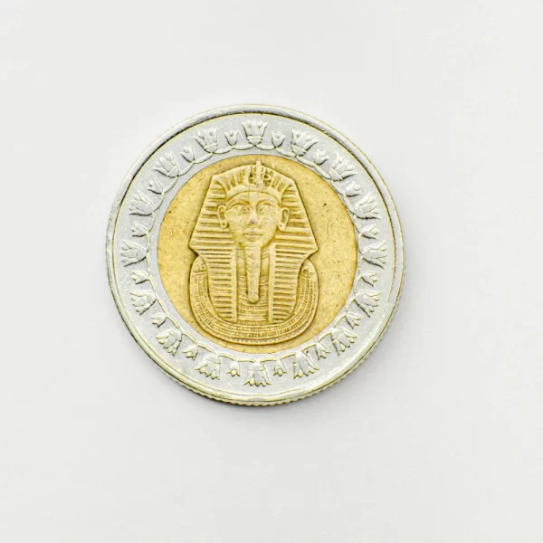 Coin crest cresting the peak of numismatic.